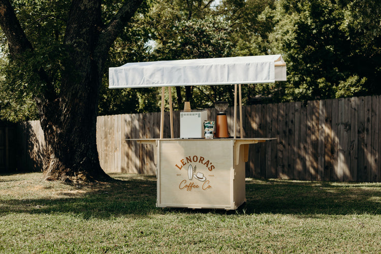 Cartssify mobile coffee cart set up with an espresso machine and grinder in a hotel lobby